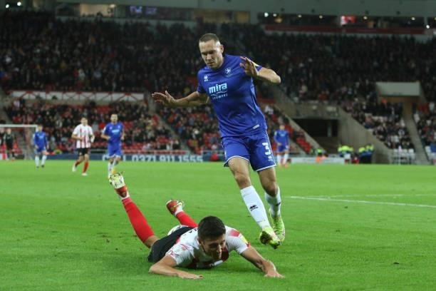 Ross Stewart of Sunderland is fouled by Chris Hussey of Cheltenham Town during the Sky Bet League 1 match between Sunderland and Cheltenham Town at...