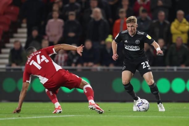Sheffield United's Ben Osborn in action with Middlesbrough's Lee Peltier during the Sky Bet Championship match between Middlesbrough and Sheffield...