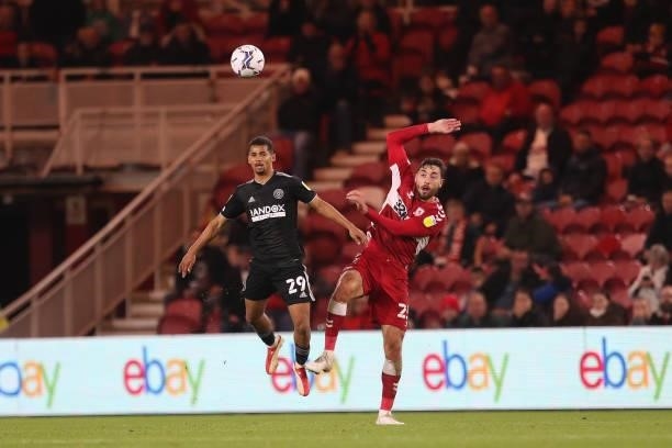 Sheffield United's Iliman Ndiaye contests a header with Middlesbrough's Matt Crooks during the Sky Bet Championship match between Middlesbrough and...