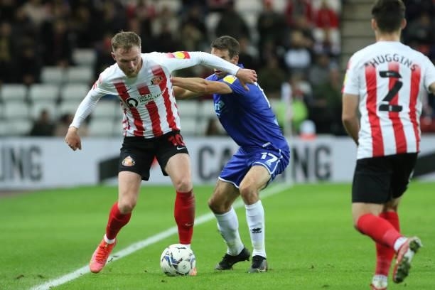 Aiden O'Brien of Sunderland and Matty Blair of Cheltenham Town in action during the Sky Bet League 1 match between Sunderland and Cheltenham Town at...