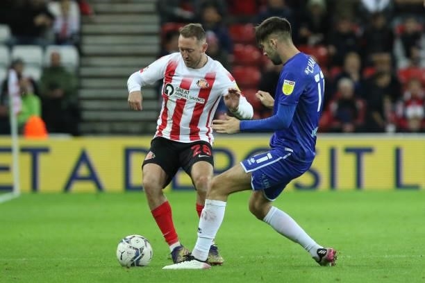 Aiden McGeady of Sunderland and Ellis Chapman of Cheltenham Town in action during the Sky Bet League 1 match between Sunderland and Cheltenham Town...