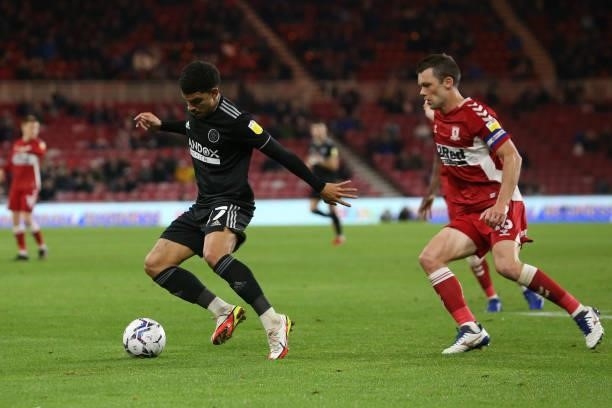 Sheffield United's Morgan Gibbs-White in action with Middlesbrough's Jonathan Howson during the Sky Bet Championship match between Middlesbrough and...
