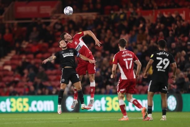 Sheffield United's Billy Sharp contests a header with Middlesbrough's Dael Fry during the Sky Bet Championship match between Middlesbrough and...