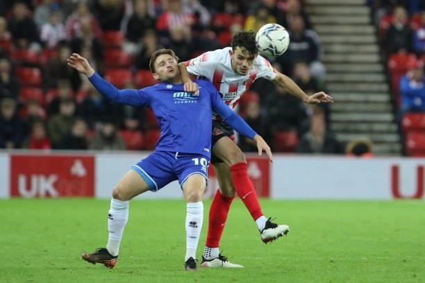 Alfie May of Cheltenham Town and Tom Flanagan of Sunderland in action during the Sky Bet League 1 match between Sunderland and Cheltenham Town at the...