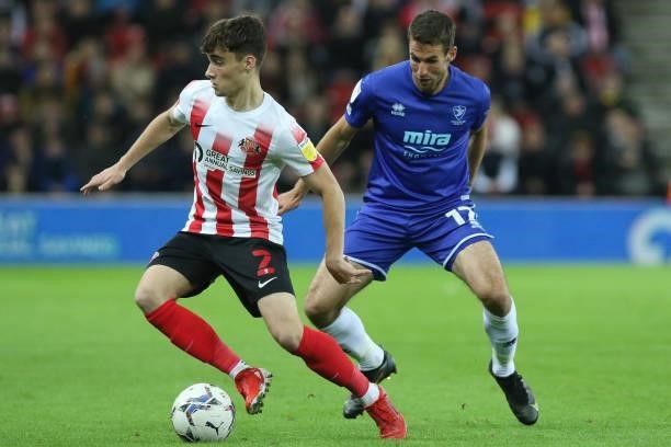 Niall Huggins of Sunderland and Matty Blair of Cheltenham Town in action during the Sky Bet League 1 match between Sunderland and Cheltenham Town at...