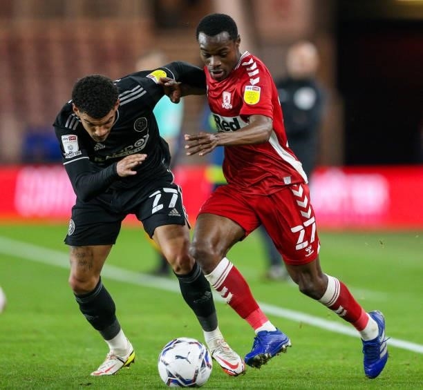 Middlesbrough's Marc Bola battles with Sheffield United's Morgan Gibbs-White during the Sky Bet Championship match between Middlesbrough and...
