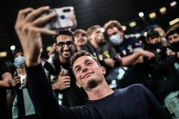 Italian athlete Filippo Tortu takes a selfie with fans prior to the UEFA Champions League Group H football match between Juventus and Chelsea on...