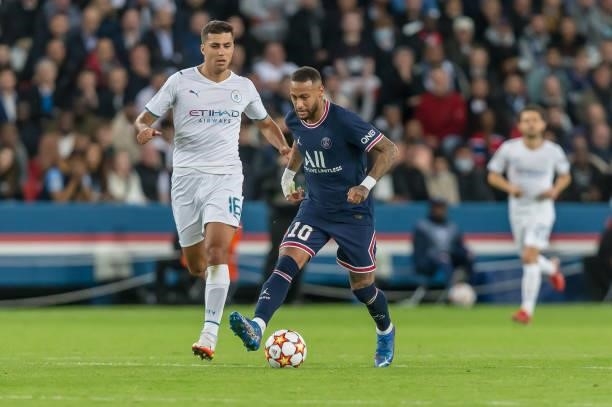 Rodri of Manchester City and Neymar of Paris Saint-Germain battle for the ball during the UEFA Champions League match between Paris Saint Germain and...
