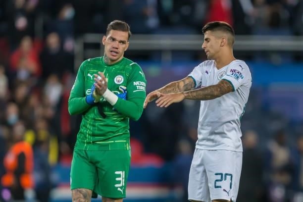 Goalkeeper Ederson of Manchester City and Joao Cancelo of Manchester City gestures during the UEFA Champions League match between Paris Saint Germain...