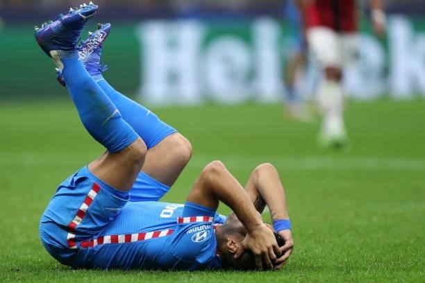 Luis Suarez of Atletico Madrid lies on the ground during the UEFA Champions League Group B match between AC Milan and Atletico Madrid at Giuseppe...