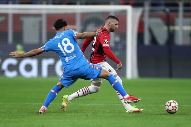 Ante Rebic of AC Milan and Felipe Augusto of Atletico Madrid battle for the ball during the UEFA Champions League Group B match between AC Milan and...