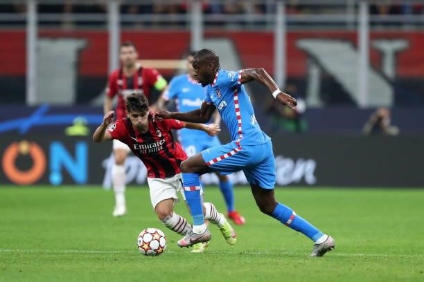 Geoffrey Kondogbia of Atletico Madrid and Brahim Diaz of AC Milan battle for the ball during the UEFA Champions League Group B match between AC Milan...