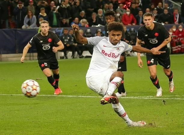 Salzburg's German forward Karim Adeyemi scores from the penalty spot during the UEFA Champions League Group G football match between RB Salzburg and...