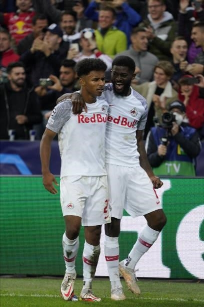 Karim Adeyemi of Salzburg and Jerome Onguene of Salzburg celebrate his goal to 1:0 during the UEFA Champions League group G match between FC Red Bull...