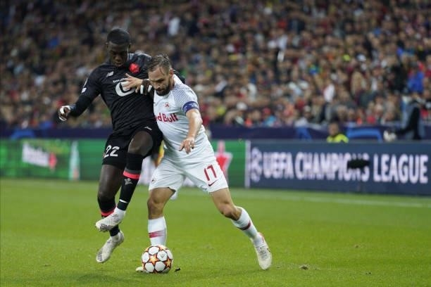 Timothy Weah of Lille and Andreas Ulmer of Salzburg during the UEFA Champions League group G match between FC Red Bull Salzburg and Lille OSC at Red...