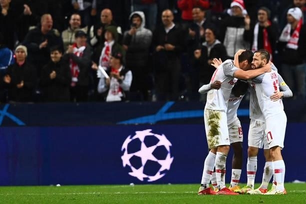 Salzburg players celebrate after the UEFA Champions League Group G football match between RB Salzburg and Lille LOSC in Salzburg, Austria on...