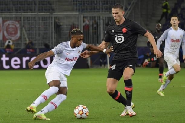 Junior Adamu of Salzburg and Sven Botman of Lille during the UEFA Champions League group G match between FC Red Bull Salzburg and Lille OSC at Red...