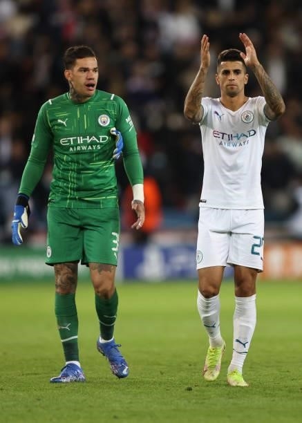 Joao Cancelo of Manchester City applauds as Ederson looks on during the UEFA Champions League group A match between Paris Saint-Germain and...