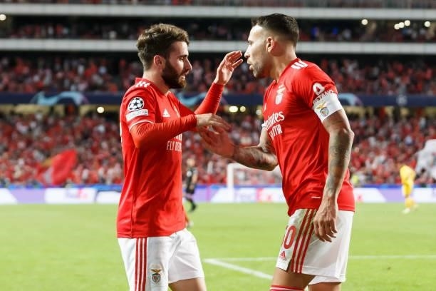 Rafa Silva of SL Benfica celebrates after scoring his team's second goal with teammates during the UEFA Champions League group E match between SL...