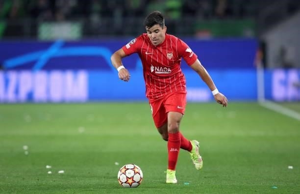 Sevilla's Argentinian defender Marcos Acuna plays the ball during the UEFA Champions League Group G football match between VfL Wolfsburg and Sevilla...