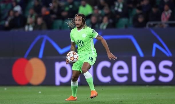 Wolfsburg's Swiss defender Kevin Mbabu plays the ball during the UEFA Champions League Group G football match between VfL Wolfsburg and Sevilla FC in...