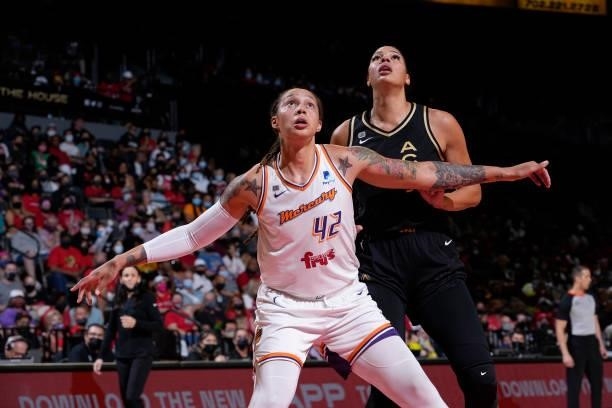 Brittney Griner of the Phoenix Mercury and Liz Cambage of the Las Vegas Aces look up during Game Two of the 2021 WNBA Semifinals on September 30,...