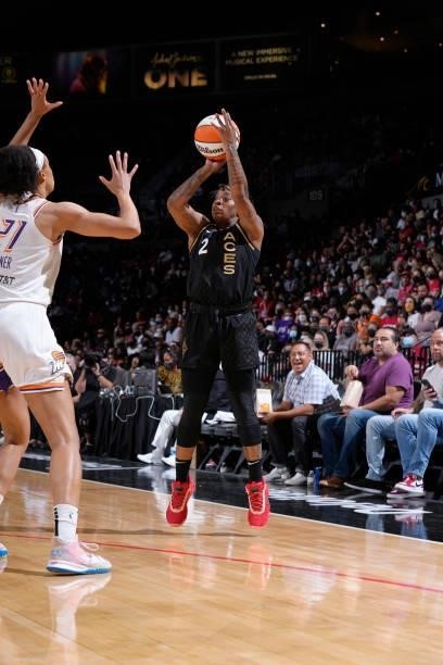 Riquna Williams of the Las Vegas Aces shoots a three point basket over Brianna Turner of the Phoenix Mercury during Game Two of the 2021 WNBA...