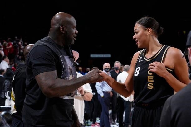 Former NBA Player, Shaquille O'Neal high fives Liz Cambage of the Las Vegas Aces after the game against the Phoenix Mercury during Game Two of the...