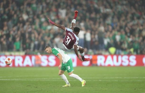 West Ham United's Ben Johnson and Rapid Vienna's Maximilian Ullmann during the UEFA Europa League group H match between West Ham United and Rapid...