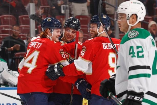 Markus Nutivaara celebrates his goal with Sam Bennett and Owen Tippett of the Florida Panthers against the Dallas Stars during a preseason game at...