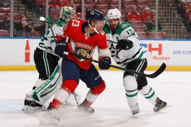 Blake Comeau of the Dallas Stars checks Carter Verhaeghe of the Florida Panthers in front of the net during a preseason game at the FLA Live Arena on...