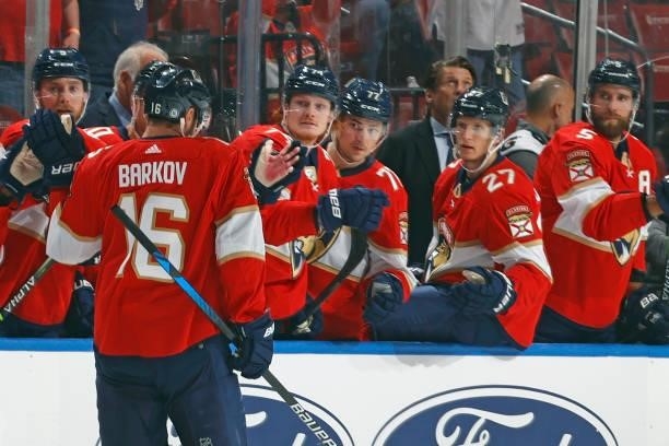 Teammates congratulate Aleksander Barkov of the Florida Panthers after he scored a first period goal against the Dallas Stars during a preseason game...