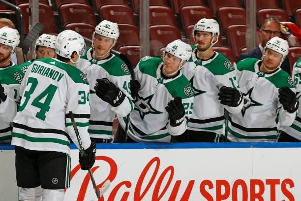 Teammates congratulate Denis Gurianov of the Dallas Stars after he scored a second period goal against the Florida Panthers during a preseason game...