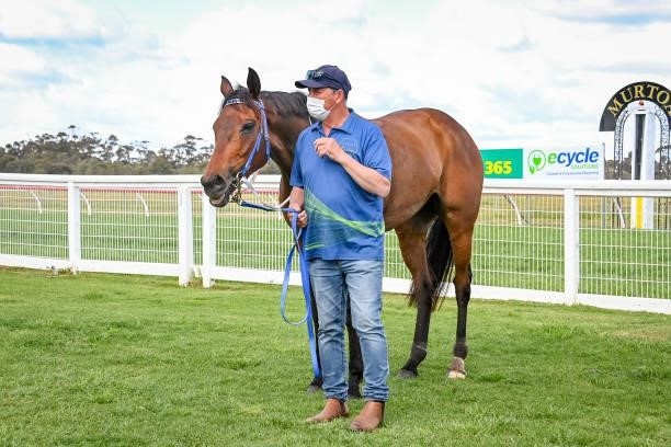 Peter Chow with Hostar after winning the Ecycle Solutions Murtoa Cup at Murtoa Racecourse on October 02, 2021 in Murtoa, Australia.