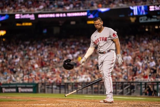 Rafael Devers of the Boston Red Sox reacts after striking out during the eighth inning of a game against the Washington Nationals on October 2, 2021...