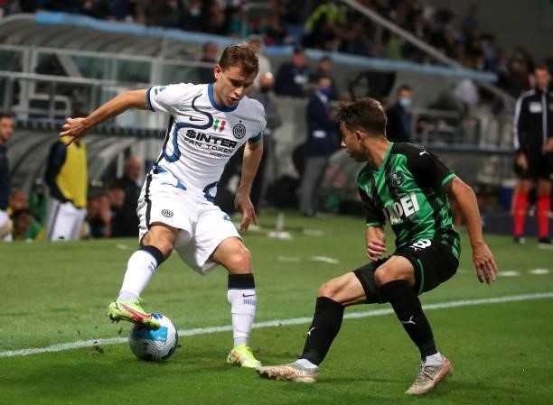 Nicolo Barella of FC Internazionale competes for the ball with Maxime Lopez of US Sassuolo ,during the Serie A match between US Sassuolo v FC...