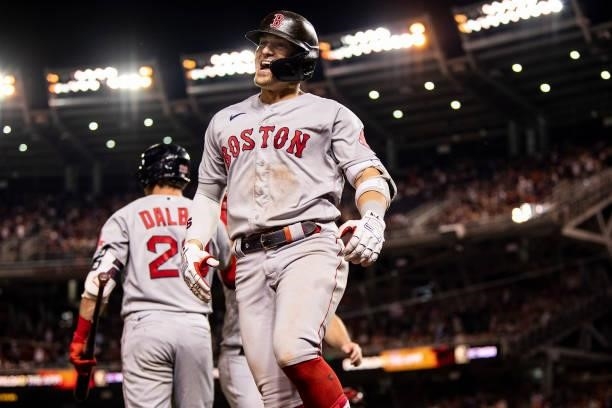 Enrique Hernandez of the Boston Red Sox reacts after hitting a two-run home run during the ninth inning of a game against the Washington Nationals on...