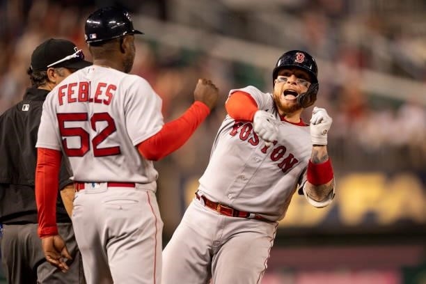 Christian Vazquez of the Boston Red Sox reacts after hitting an RBI triple to gives his team the lead during the ninth inning of a game against the...