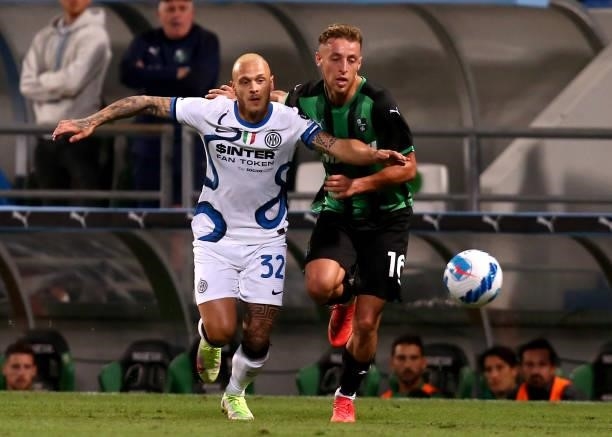 Federico Dimarco of FC Internazionale competes for the ball with Davide Frattesi of US Sassuolo ,during the Serie A match between US Sassuolo v FC...