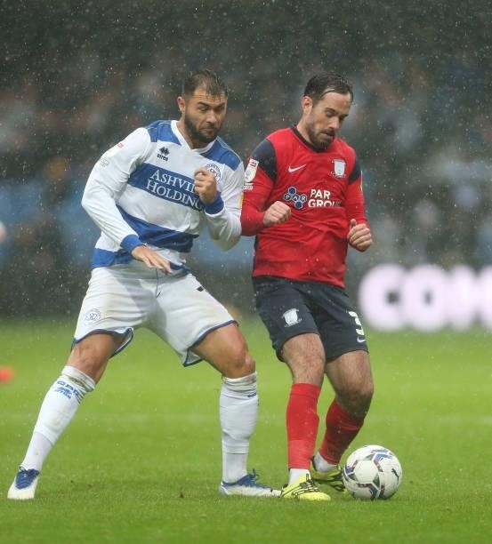 Preston North End's Greg Cunningham and Queens Park Rangers' Charlie Austin during the Sky Bet Championship match between Queens Park Rangers and...
