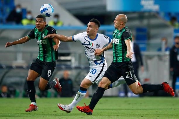 Rogerio of Sasssuolo, Lautaro Martinez of FC Internazionale and Vlad Chiriches of Sasssuolo battle for the ball during the Serie A match between US...