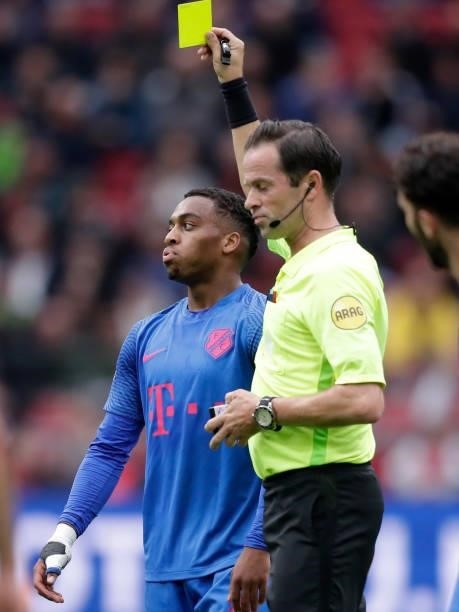 Quinten Timber of FC Utrecht receives a yellow card from Referee Bas Nijhuis during the Dutch Eredivisie match between Ajax v FC Utrecht at the Johan...