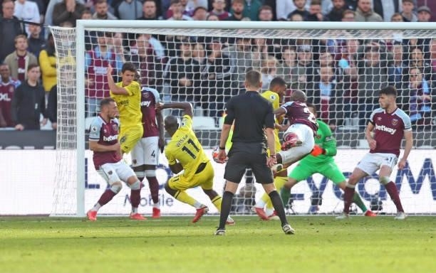 Brentford's Yoane Wissa scores his side's first goal during the Premier League match between West Ham United and Brentford at London Stadium on...