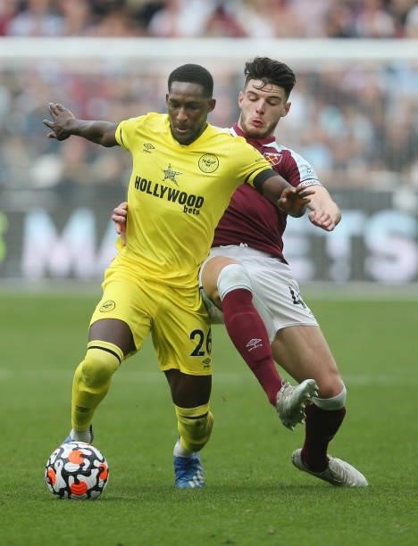 Brentford's Shandon Baptiste and West Ham United's Declan Rice during the Premier League match between West Ham United and Brentford at London...