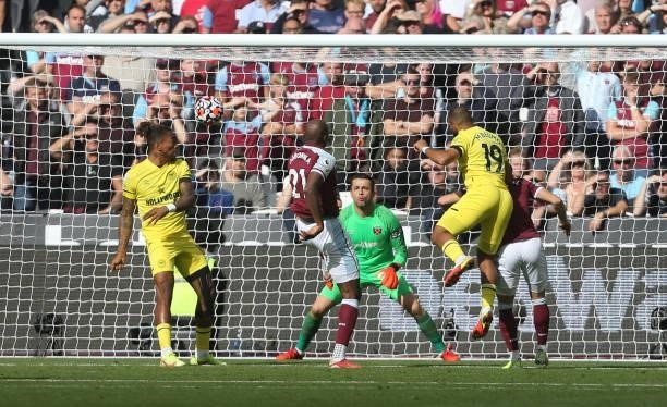 Brentford's Bryan Mbeumo with a header in the first half during the Premier League match between West Ham United and Brentford at London Stadium on...