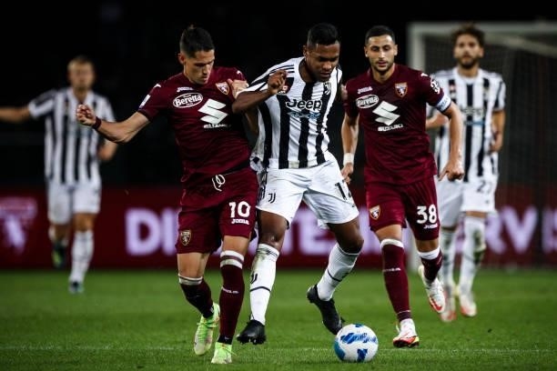 Juventus defender Alex Sandro fights for the ball against Torino midfielder Sasa Lukic during the Serie A football match n.7 TORINO - JUVENTUS on...