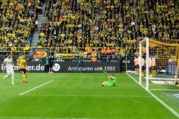 Andi Zeqiri of FC Augsburg scores his team's first goal during the Bundesliga match between Borussia Dortmund and FC Augsburg at Signal Iduna Park on...