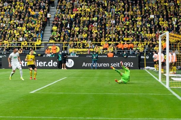 Andi Zeqiri of FC Augsburg scores his team's first goal during the Bundesliga match between Borussia Dortmund and FC Augsburg at Signal Iduna Park on...