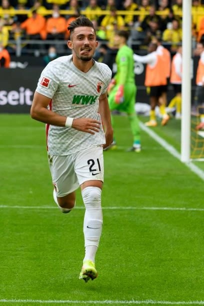 Andi Zeqiri of FC Augsburg celebrates after scoring his team's first goal during the Bundesliga match between Borussia Dortmund and FC Augsburg at...