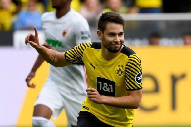Raphael Guerreiro of Borussia Dortmund celebrates after scoring his team's first goal during the Bundesliga match between Borussia Dortmund and FC...